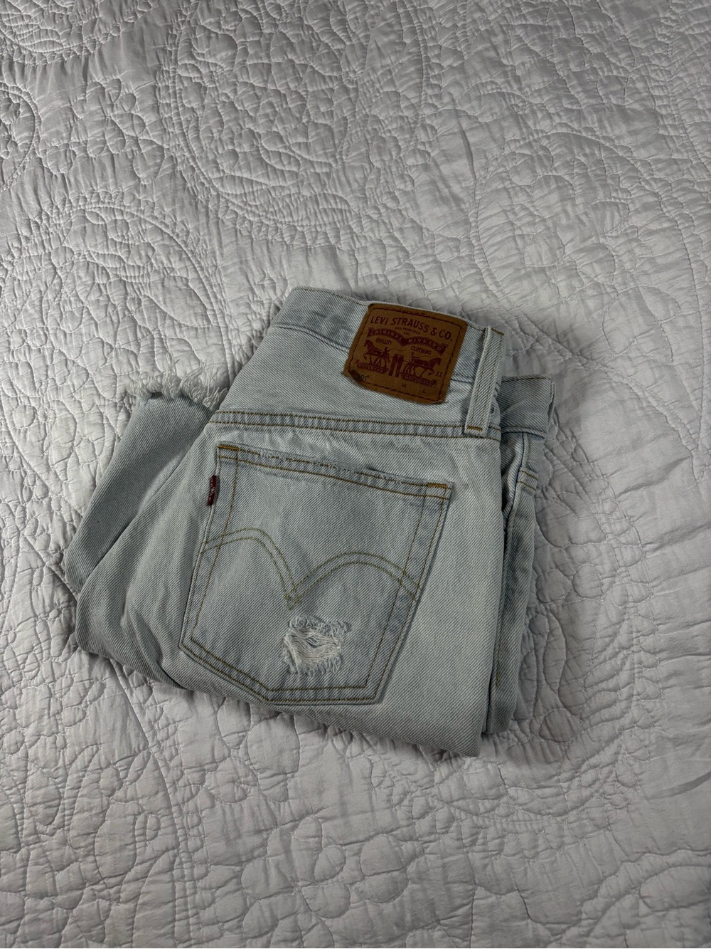Levi's Women's Pale Blue High-Rise Jeans with Back Pocket Distress
